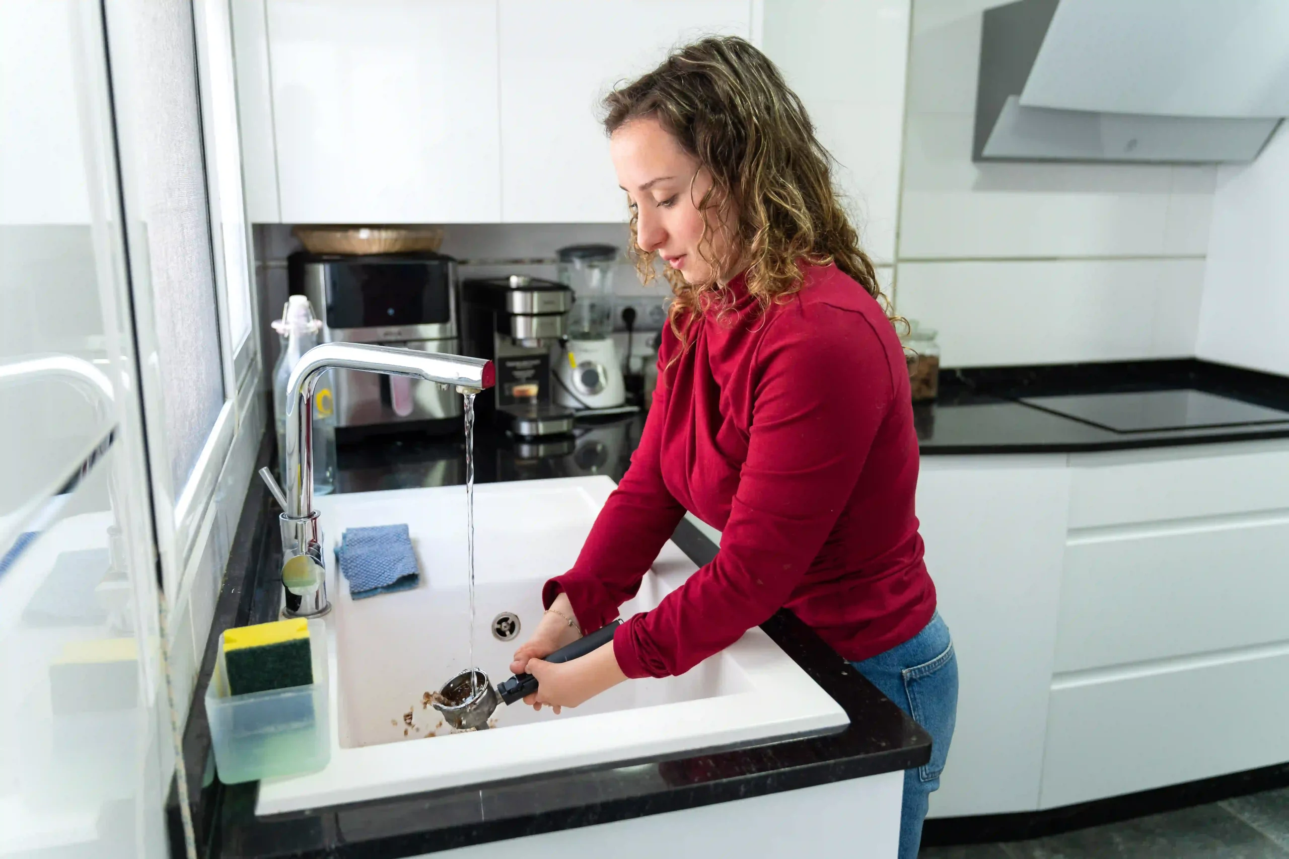 Disabled women doing washing dishes in kitchen
